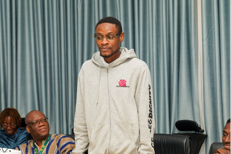A student speaks on behalf of the class during the reflection and feedback session.
