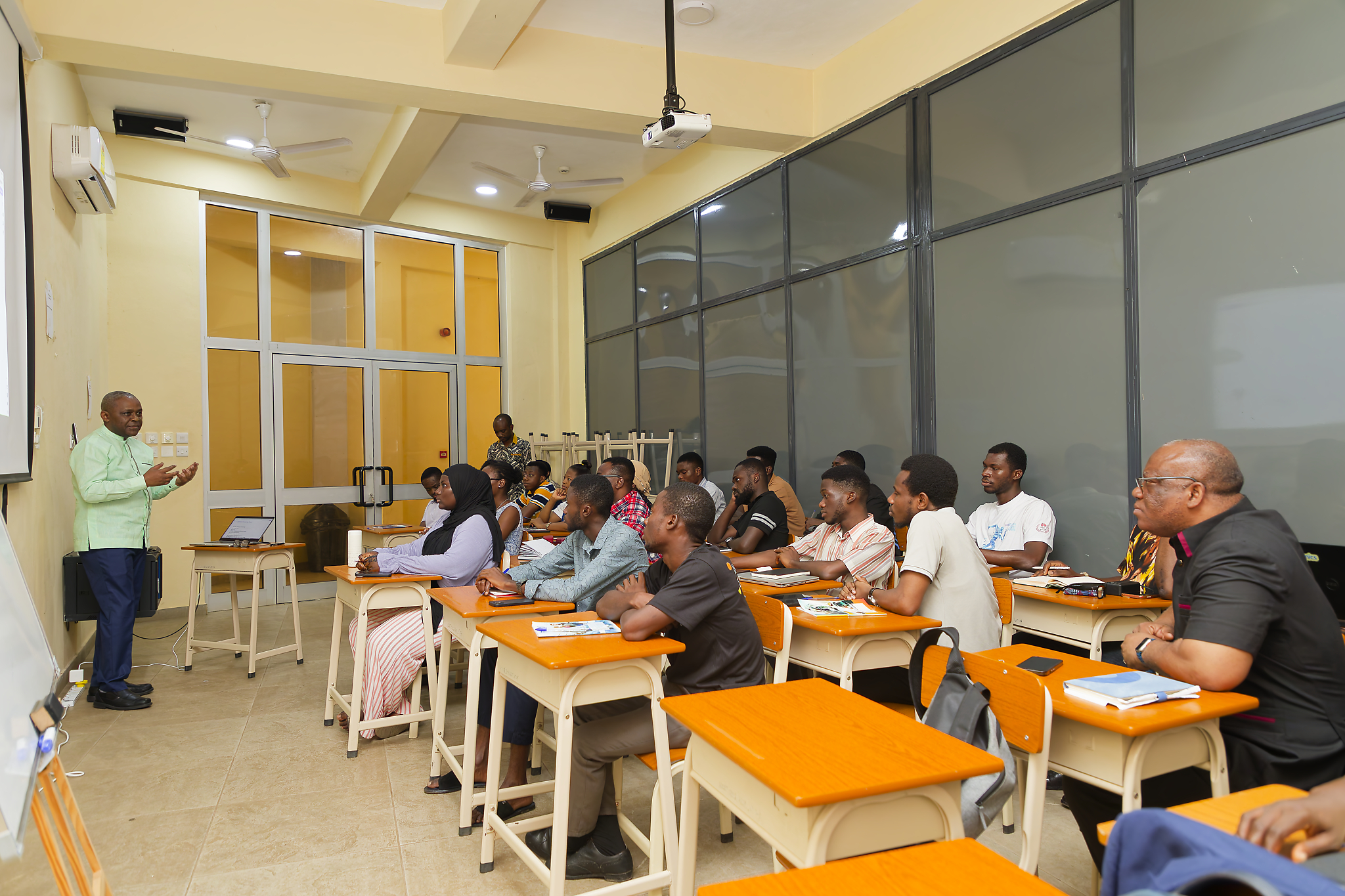 Prof. Murenzi engaged with students.